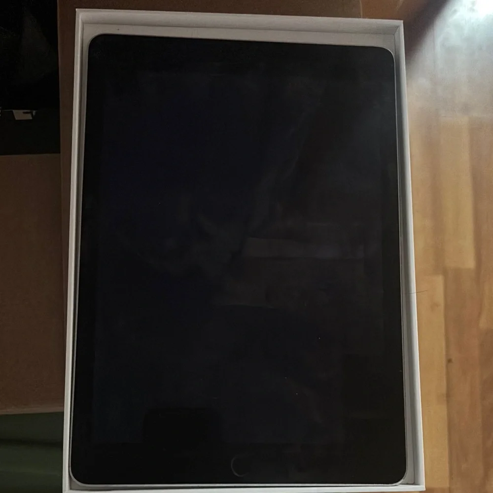 Apple Black Tablet with Reflective Screen and Rounded Corners